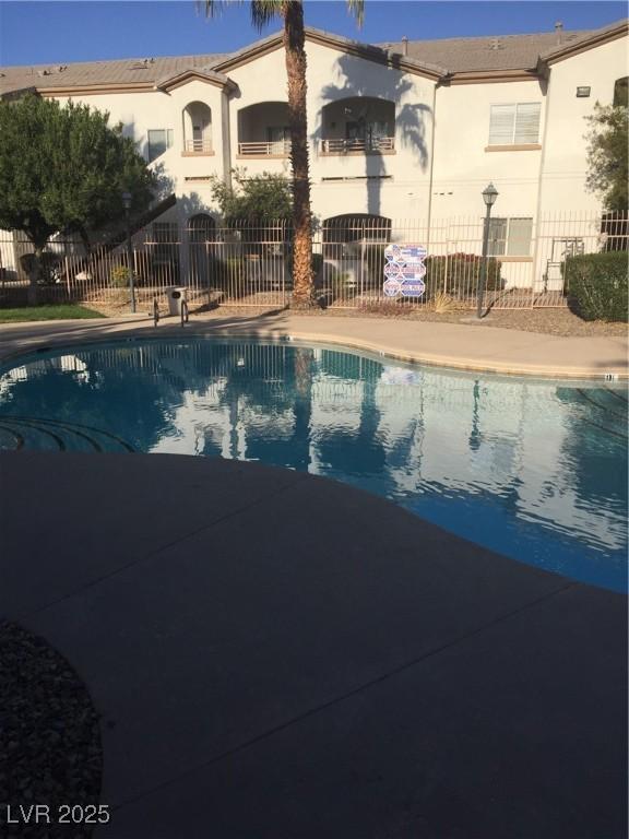 community pool with fence