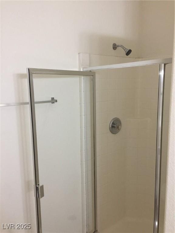 full bathroom featuring a stall shower