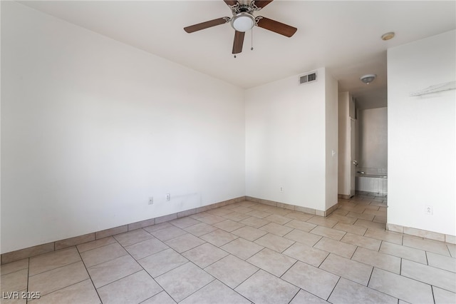 5655 E Sahara Ave Unit 1037, Las Vegas, NV 89142 - spare room with light tile patterned floors, ceiling fan, baseboards, and a smoke detector