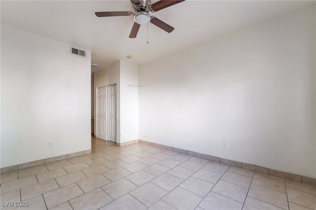 5655 E Sahara Ave Unit 1037, Las Vegas, NV 89142 - empty room featuring a ceiling fan, light tile patterned floors, and baseboards