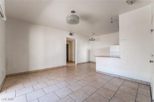 5655 E Sahara Ave Unit 1037, Las Vegas, NV 89142 - spare room with light tile patterned floors and baseboards