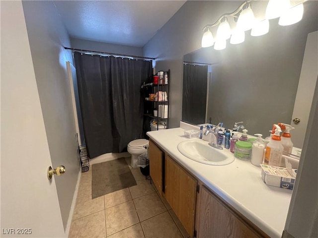 full bath with tile patterned flooring, vanity, toilet, and curtained shower