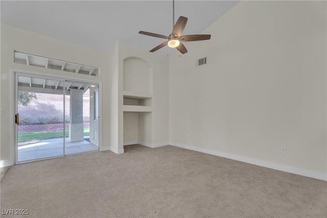 unfurnished living room with carpet floors, a ceiling fan, baseboards, and lofted ceiling