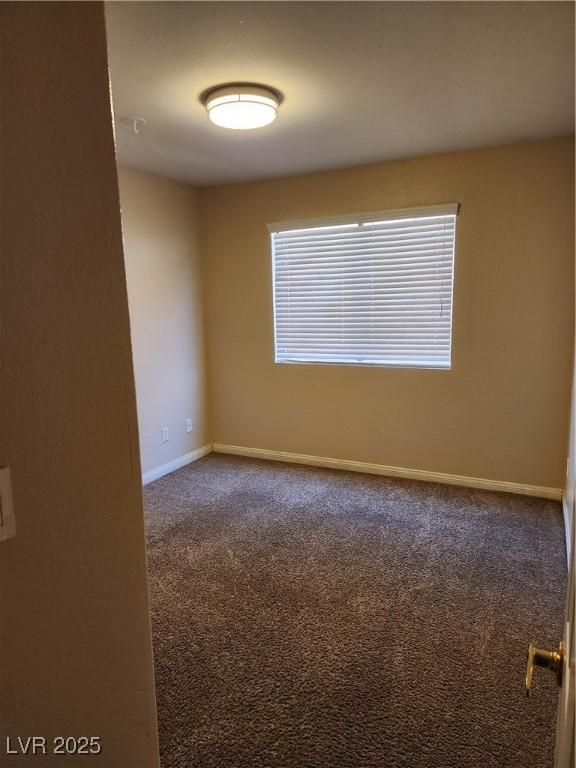 2974 Juniper Hills Blvd Unit 104, Las Vegas, NV 89142 - carpeted empty room with baseboards