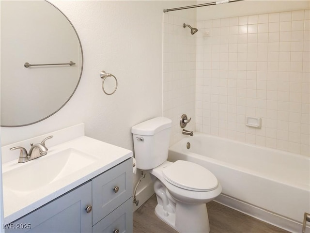 full bath with toilet, vanity, and washtub / shower combination