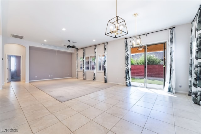 unfurnished living room with light tile patterned floors, a chandelier, recessed lighting, a ceiling fan, and baseboards