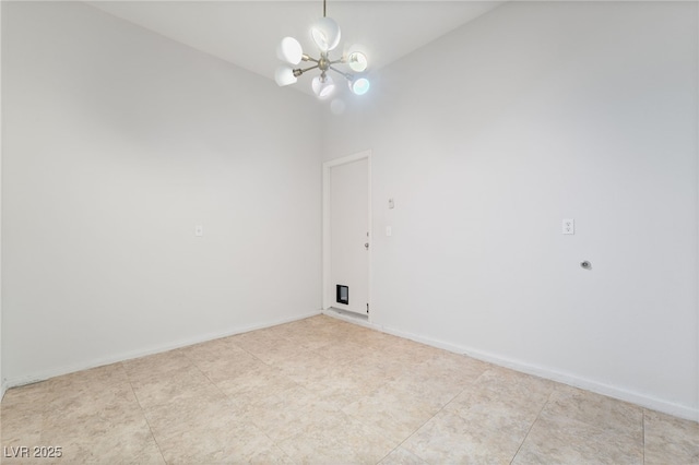spare room featuring a chandelier, lofted ceiling, baseboards, and light tile patterned flooring