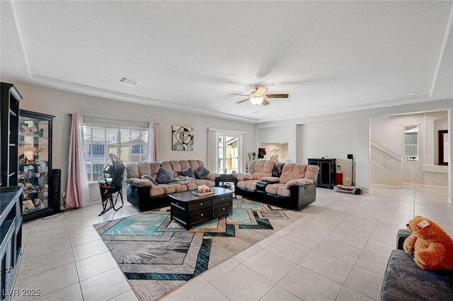 9656 Paraiso Springs St, Las Vegas, NV 89139 - living area with light tile patterned floors, ceiling fan, and a tray ceiling