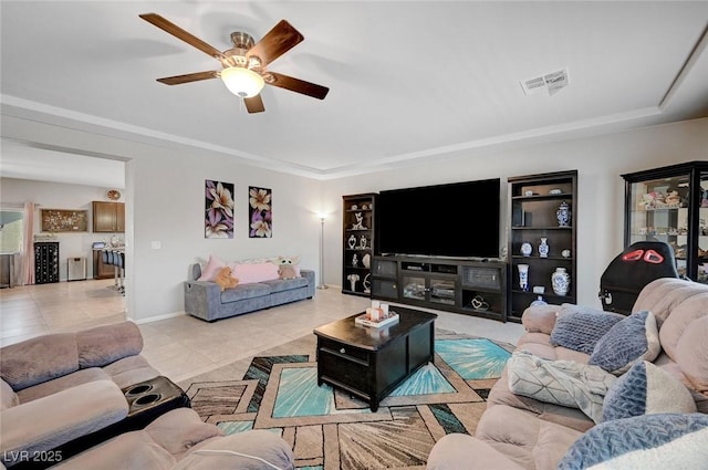 9656 Paraiso Springs St, Las Vegas, NV 89139 - living area with light tile patterned flooring, ceiling fan, a tray ceiling, baseboards, and built in features