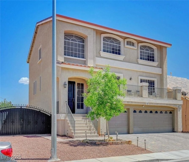 9656 Paraiso Springs St, Las Vegas, NV 89139 - view of front of property with stucco siding, an attached garage, driveway, and a gate