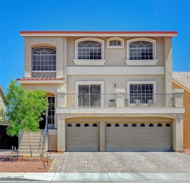 9656 Paraiso Springs St, Las Vegas, NV 89139 - view of front of property featuring stucco siding, an attached garage, and decorative driveway
