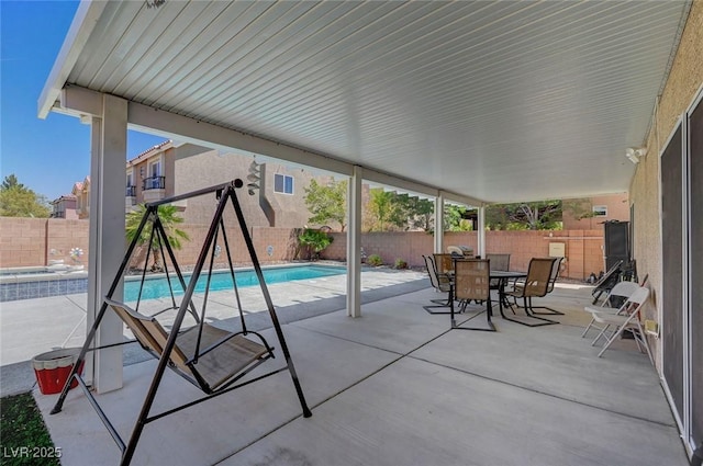 9656 Paraiso Springs St, Las Vegas, NV 89139 - view of patio featuring a fenced backyard and outdoor dining space