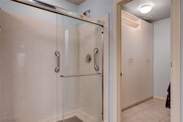 9656 Paraiso Springs St, Las Vegas, NV 89139 - bathroom featuring a shower stall and tile patterned flooring