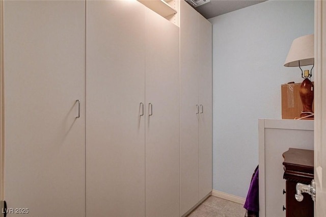 9656 Paraiso Springs St, Las Vegas, NV 89139 - spacious closet featuring light tile patterned floors
