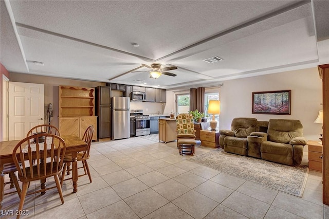 9656 Paraiso Springs St, Las Vegas, NV 89139 - living area with light tile patterned flooring, a textured ceiling, and ceiling fan