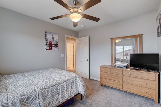 9656 Paraiso Springs St, Las Vegas, NV 89139 - bedroom with light colored carpet, a ceiling fan, and baseboards