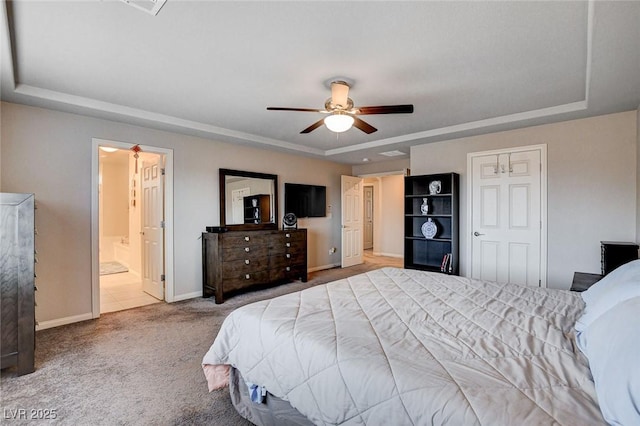 9656 Paraiso Springs St, Las Vegas, NV 89139 - carpeted bedroom featuring a tray ceiling and baseboards