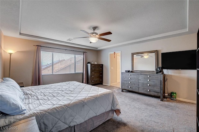 9656 Paraiso Springs St, Las Vegas, NV 89139 - bedroom featuring a raised ceiling, carpet flooring, a textured ceiling, baseboards, and a ceiling fan