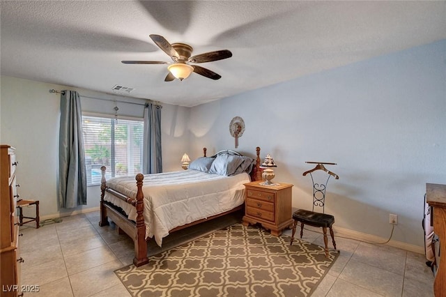 9656 Paraiso Springs St, Las Vegas, NV 89139 - bedroom featuring light tile patterned floors, baseboards, a ceiling fan, and a textured ceiling