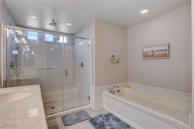 9656 Paraiso Springs St, Las Vegas, NV 89139 - bathroom with a bath, a shower stall, tile patterned flooring, and vanity