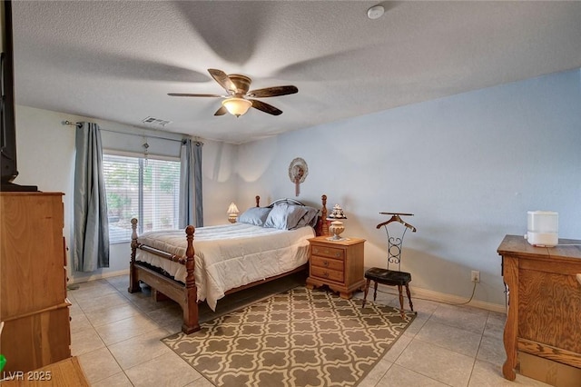 9656 Paraiso Springs St, Las Vegas, NV 89139 - bedroom featuring light tile patterned flooring, a textured ceiling, baseboards, and ceiling fan