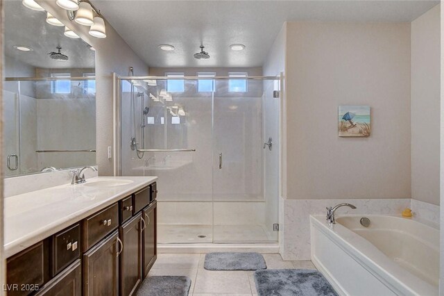 9656 Paraiso Springs St, Las Vegas, NV 89139 - full bathroom with a stall shower, vanity, tile patterned flooring, and a garden tub