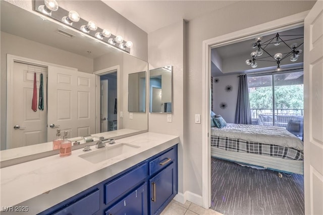 91 E Agate Ave Unit 204, Las Vegas, NV 89123 - full bath with connected bathroom, vanity, baseboards, and tile patterned floors