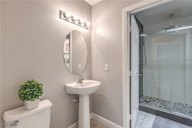 91 E Agate Ave Unit 204, Las Vegas, NV 89123 - full bath featuring a shower stall, toilet, and tile patterned floors
