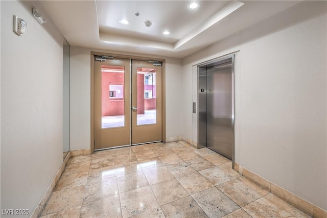91 E Agate Ave Unit 204, Las Vegas, NV 89123 - spare room with elevator, baseboards, a raised ceiling, french doors, and recessed lighting