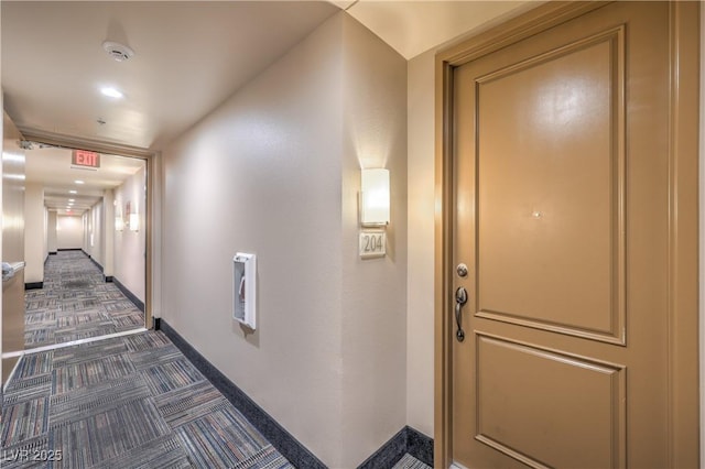 91 E Agate Ave Unit 204, Las Vegas, NV 89123 - hall with dark colored carpet and baseboards