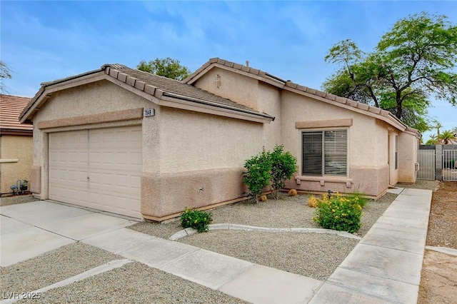 7949 Long Beach St, Las Vegas, NV 89139 - view of front facade featuring a garage, stucco siding, concrete driveway, and fence
