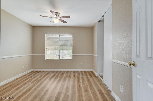 7949 Long Beach St, Las Vegas, NV 89139 - unfurnished room with light wood finished floors, ceiling fan, and baseboards