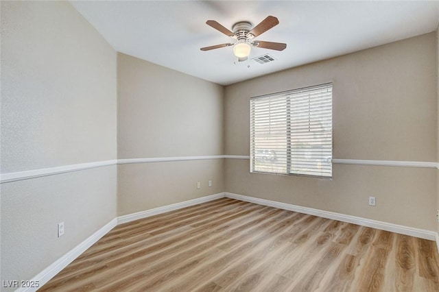 7949 Long Beach St, Las Vegas, NV 89139 - empty room featuring baseboards, wood finished floors, and a ceiling fan