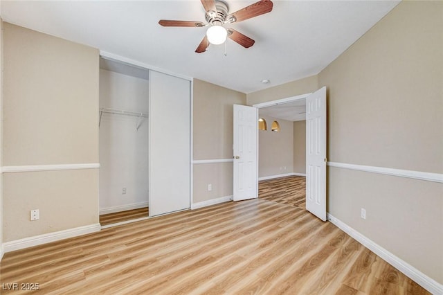 7949 Long Beach St, Las Vegas, NV 89139 - unfurnished bedroom featuring wood finished floors, a closet, baseboards, and a ceiling fan