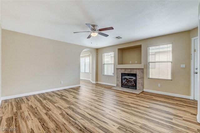 7949 Long Beach St, Las Vegas, NV 89139 - unfurnished living room with a ceiling fan, light wood finished floors, baseboards, and plenty of natural light