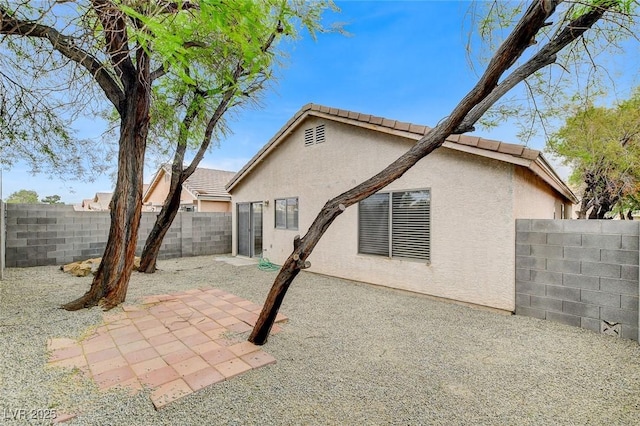 7949 Long Beach St, Las Vegas, NV 89139 - back of property featuring stucco siding, a fenced backyard, and a patio