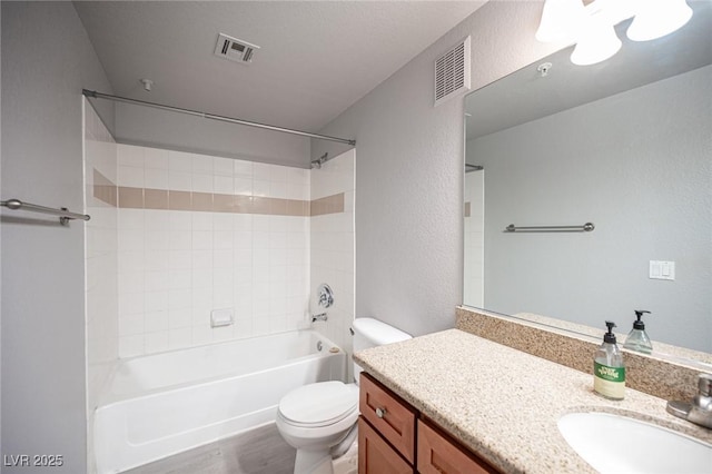 4400 S Jones Blvd Unit 2075, Las Vegas, NV 89103 - bathroom featuring toilet, vanity, wood finished floors, bathtub / shower combination, and a textured wall