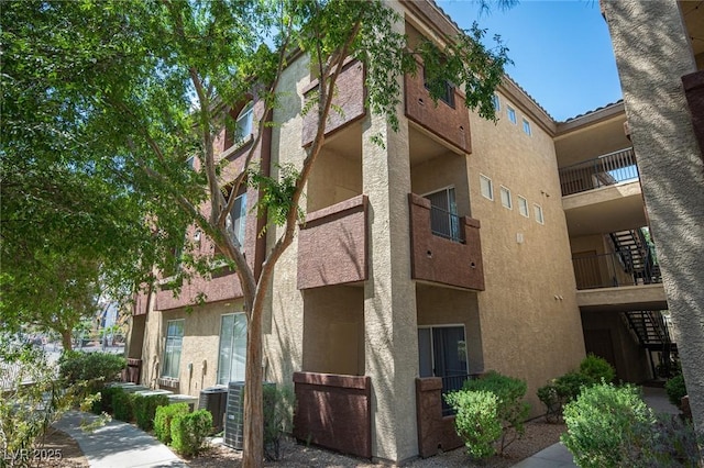 4400 S Jones Blvd Unit 2075, Las Vegas, NV 89103 - view of apartment building / complex featuring stairs and cooling unit