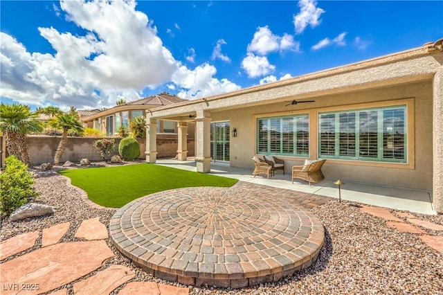 1964 Oliver Springs St, Henderson, NV 89052 - rear view of property featuring a ceiling fan, stucco siding, and a patio