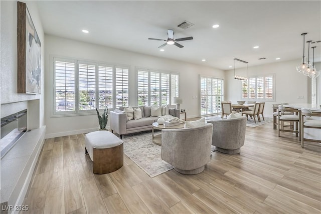 1964 Oliver Springs St, Henderson, NV 89052 - living area with a fireplace, light wood-style floors, ceiling fan, baseboards, and recessed lighting