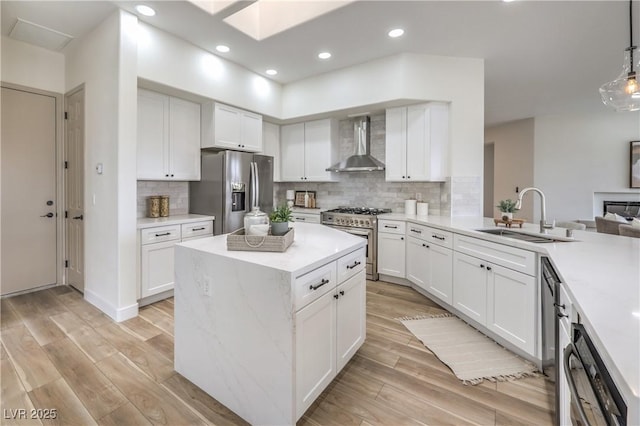 1964 Oliver Springs St, Henderson, NV 89052 - kitchen featuring wall chimney exhaust hood, appliances with stainless steel finishes, a sink, white cabinets, and recessed lighting