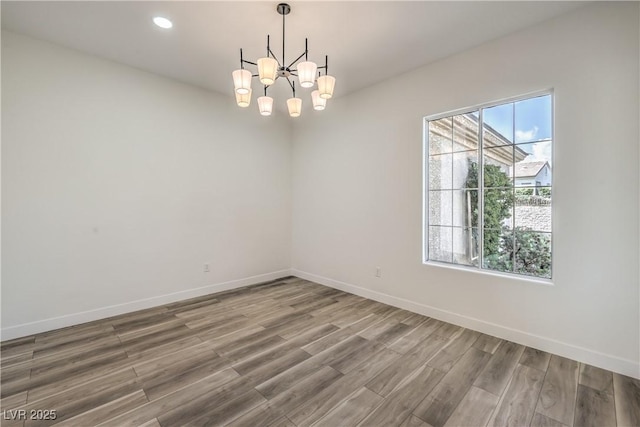 1964 Oliver Springs St, Henderson, NV 89052 - unfurnished room featuring a chandelier, wood finished floors, baseboards, and recessed lighting