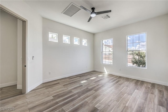 1964 Oliver Springs St, Henderson, NV 89052 - unfurnished room with a ceiling fan, light wood-style flooring, and baseboards