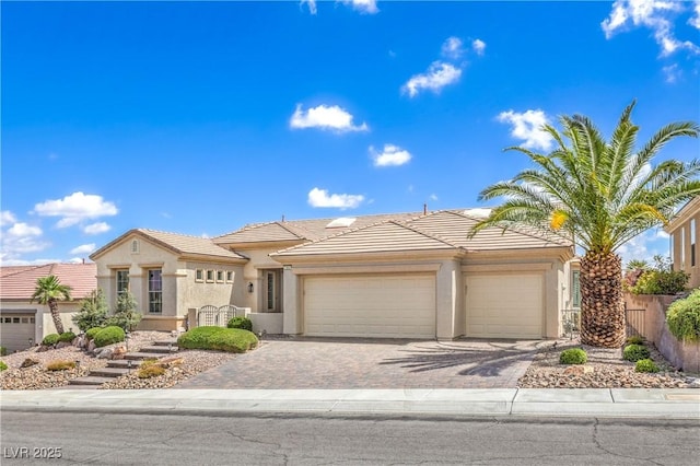 1964 Oliver Springs St, Henderson, NV 89052 - view of front of property with stucco siding, a tiled roof, and an attached garage