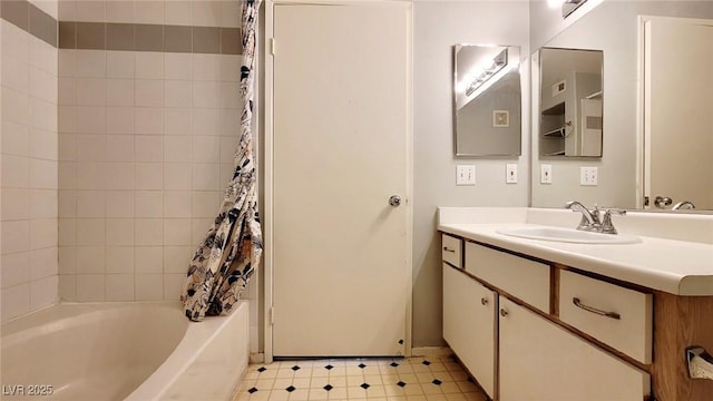 full bath with vanity, shower / tub combo with curtain, and tile patterned floors