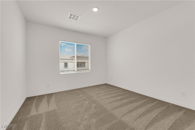 carpeted spare room with baseboards and recessed lighting