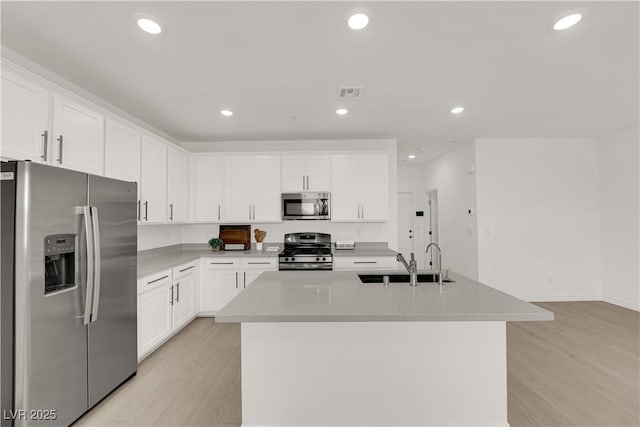 334 Laurel Peak Dr, Henderson, NV 89015 - kitchen with appliances with stainless steel finishes, a sink, white cabinets, and recessed lighting