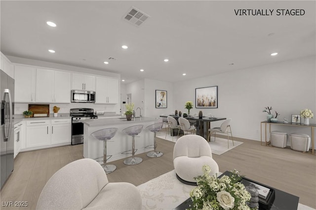 334 Laurel Peak Dr, Henderson, NV 89015 - living area featuring light wood-type flooring, recessed lighting, and baseboards