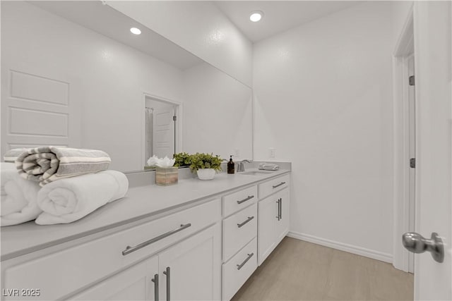334 Laurel Peak Dr, Henderson, NV 89015 - bathroom with vanity, recessed lighting, and baseboards