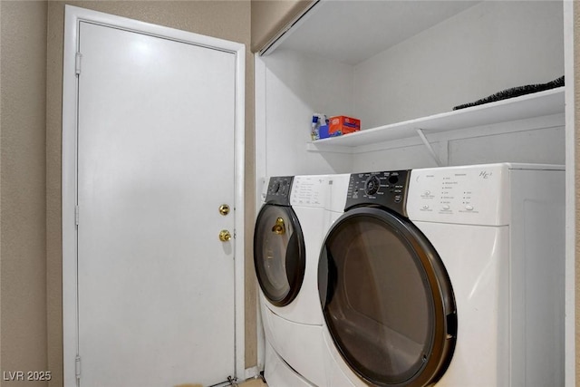 washroom with washing machine and dryer